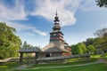 Wooden church with gate in open air musem near Bardejovske kupele spa resort during summer