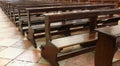 wooden Church pew bench with kneeler inside a Christian church Royalty Free Stock Photo