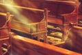 Wooden church pews in church and rosary beads Royalty Free Stock Photo