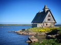 Wooden church on the shore of the White Sea, Rabocheostrovsk, Karelia, Russia, June 2019 Royalty Free Stock Photo
