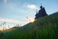 Wooden church on the top of the hill. Vershinino village sunset view. Arkhangelsk region, Northern Russia. Royalty Free Stock Photo