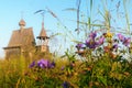 Wooden church on the top of the hill. Vershinino village sunset view. Arkhangelsk region, Northern Russia. Royalty Free Stock Photo