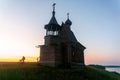 Wooden church on the top of the hill. Vershinino village sunset view. Arkhangelsk region, Northern Russia. Royalty Free Stock Photo