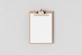 Wooden clipboard mockup with a blank paper. Top view Royalty Free Stock Photo