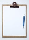 Wooden clipboard with white sheet on Royalty Free Stock Photo