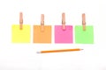 Wooden clips,Clothespin Sticky notes and a pencil isolate on white background concepts Royalty Free Stock Photo