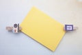 Wooden clips and sticky note Royalty Free Stock Photo