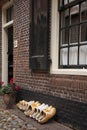 Wooden clogs farmers next door to the old Dutch farm Royalty Free Stock Photo