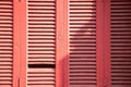 Wooden closed red color shutters for background