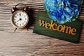 Wooden Closed sign and alarm clock with space copy on wooden background Royalty Free Stock Photo