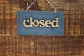 Wooden Closed sign with space copy on wooden background Royalty Free Stock Photo
