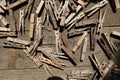 Wooden clothes pegs on the brown table Royalty Free Stock Photo