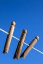 Wooden clothes pegs on a washing line Royalty Free Stock Photo