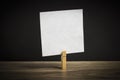 Wooden clothespin with a sheet of paper. Planning. Message Royalty Free Stock Photo