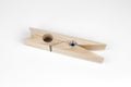 Wooden clothespin on a white background. Royalty Free Stock Photo