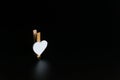 Wooden clothespin white heart on black background Royalty Free Stock Photo