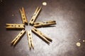 Wooden clothespins on a metal plate