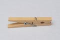 Wooden clothespins on white background close clamp