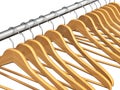 Wooden coat hangers on clothes rail