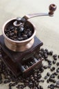 Wooden coffee grinder and coffee beans Royalty Free Stock Photo