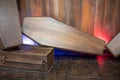 Wooden coffin against wooden background for display.