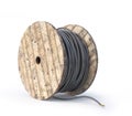 Wooden coil with cable on a white background.
