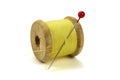 Wooden coil with threads and pin for sewing on a white background Royalty Free Stock Photo