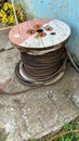 Wooden Coils Of Electric wire Outdoor. High and low voltage cables on white background. Large cable for electrical work