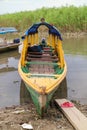 Wooden color canoe in river port Royalty Free Stock Photo