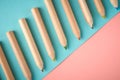 Wooden color pencils on blue background, flat lay