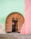 Wooden colored old vintage gate or door in Sighisoara citadel. Colorful painted walls