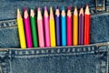 Colored pencils sticking out of blue jeans pocket Royalty Free Stock Photo