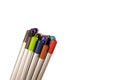 Wooden colored pencils on a white background. Bright, red, blue, green, yellow pencil ends isolated on white background.