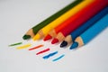 Wooden colorful crayons pencils on a white background with drawn lines Royalty Free Stock Photo