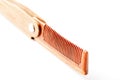 Wooden comb made of natural sandalwood for men on a white background.