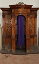 Wooden confessional inside a church with curtain Royalty Free Stock Photo