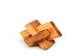 Wooden constructor puzzle oblique knot over white background