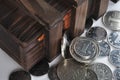 Wooden container and coins