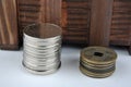 Wooden container with new and aged coins