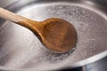 Wooden Cooking Spoon In A Stainless Pot With Boiling Water Royalty Free Stock Photo