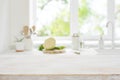 Wooden cooking table top on blurred kitchen window light background Royalty Free Stock Photo