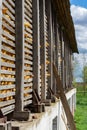 A wooden corncrib, somewhere on the Vojvodinian farm, is full of ripe ears of corn. Royalty Free Stock Photo