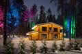 Wooden cottage with Christmas decorations in a snowy winter. Trees with bright lights in the forest near the house Royalty Free Stock Photo