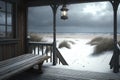 Wooden cottage, holiday home, wintertime with snow. Rustic veranda with table and old electric lamp. View of winter Baltic sea and