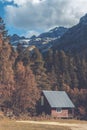 Wooden cottage house in the forest in the mountains with snow Royalty Free Stock Photo