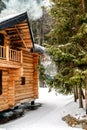 Wooden cottage house in mountain resort. Christmas winter landscape. Beautiful winter cottage covered snow. Royalty Free Stock Photo