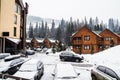 Wooden cottage house in mountain resort. Christmas winter landscape. Beautiful winter cottage covered snow. Royalty Free Stock Photo