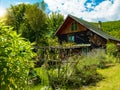 wooden cottage house traditional natural in the forest with garden Royalty Free Stock Photo