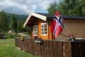 Wooden cottage with Norwegian flag, Norway