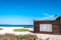 Wooden cottage with reeds window on the beach